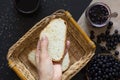 Top view of woman hand holding a piece of loaf