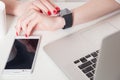 Top view of woman hand holding smart watch. Royalty Free Stock Photo