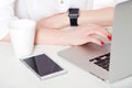 Top view of woman hand holding smart watch. Royalty Free Stock Photo