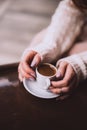 Top view of woman hands with aromatic coffee Royalty Free Stock Photo