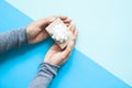 Top view of woman hands holding small gift wrapped craft paper a Royalty Free Stock Photo