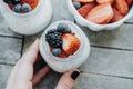 Top view of Woman hands with Pudding with chia seeds, yogurt and