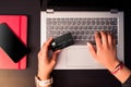 Top view woman hands typing numbers of credit card on the laptop during a shopping transaction. Online shopping concept Royalty Free Stock Photo