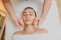 Top view of Woman having curative facial cheecks massage Royalty Free Stock Photo