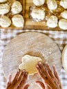 Top view of woman preparing handmade lunch like bread or pizza in traditional work at home on table in the kitchen. Unrecognizable Royalty Free Stock Photo