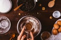 Top view woman's hands sift cocoa powder