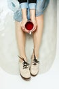 Top view of woman`s sitting in a bathtub with a cup of red tea Royalty Free Stock Photo