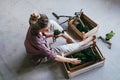 Top view woman selects stabilized moss for vertical landscaping