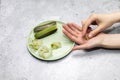 Top View Woman& x27;s Hand Holding Aloe Juice Ice Cubes, Aloe Vera Plant On Green Plate On Royalty Free Stock Photo