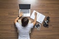 Top view of women lying working laptop computer