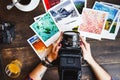 Top view of women`s hands holding printed photos Royalty Free Stock Photo