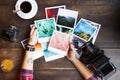 Top view of women`s hands holding printed photos Royalty Free Stock Photo