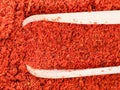 Top view of wood scoop on paprika powder closeup Royalty Free Stock Photo