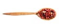 Top view of wood spoon with pink peppercorns Royalty Free Stock Photo
