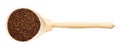 Top view of wood spoon with raw canihua grains