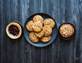 Top view of a wood table full of cakes, fruits, coffee, biscuits Royalty Free Stock Photo