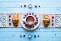 Top view of a wood table full of cakes, fruits, coffee, biscuits Royalty Free Stock Photo