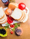 Top-view of a wood table with olives tomatoes bread Royalty Free Stock Photo