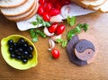 Top-view of a wood table with olives tomatoes bread Royalty Free Stock Photo