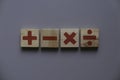 Top view of wooden Addition, subtraction, multiplication and division. They are four basic operations of elementary arithmetic