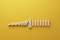 Top view wooden block stopping domino effect for business