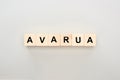 Top view of wooden blocks with Avarua lettering on grey background.