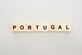 Top view of wooden blocks with Portugal lettering on white background.