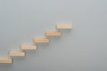 Top view of wooden blocks symbolizing career ladder isolated on grey with copy space.