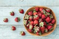 Top view of wooden bowl full of freshly picked ripe red strawberries on the rustic wooden background. Flat lay. Fresh organic food Royalty Free Stock Photo