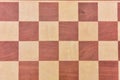Top view on wooden chess board on light wooden table background Royalty Free Stock Photo