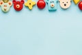 Top view of wooden children's toys on a light blue background