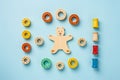 Top view of wooden children's toys on a light blue background