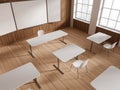 Top view of wooden classroom interior with desk in row and blackboard mockup Royalty Free Stock Photo