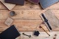 Top view on wooden desktop with books, watch and copy space for