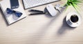 Top view of a wooden desktop with office accesoires