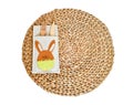 Top view wooden fork and spoon on empty circle nature serving mat isolated on a white background and clipping path. Easter meal Royalty Free Stock Photo