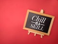 Top view wooden frame with the word Chill is a skill