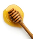Top view of wooden honey dripper in the honey puddle Royalty Free Stock Photo