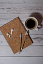 Top view, wooden Office desk with cup of coffee, eco pen, wireless headphones and recycle notebook. Business or student Royalty Free Stock Photo