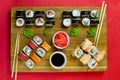 Top view of wooden platter with great set of delicious Nigiri sushi and Tempura rolls with Maki and Uramaki rolls Royalty Free Stock Photo