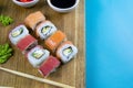 Top view of wooden platter with great set of delicious Nigiri sushi and Tempura rolls with Maki and Uramaki rolls Royalty Free Stock Photo