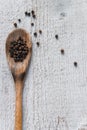 Top view of wooden spoon with black pepper Royalty Free Stock Photo