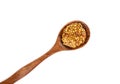 Top view of wooden spoon with Dijon mustard over white background. Royalty Free Stock Photo