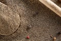 Top view of a wooden spoon full of black pepper on wooden barrel background, selective focus. Royalty Free Stock Photo