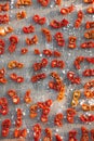 Top view of a wooden table filled with dried tomatoes Royalty Free Stock Photo