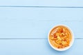 Top view on wooden table with vegetables salad or soup. Blank place for copy space Royalty Free Stock Photo