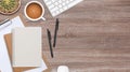 Top view wooden workspace office desk with computer and office supplies. Flat lay work table with blank notebook, keyboard, green Royalty Free Stock Photo