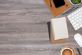 Top view wooden workspace office desk with computer and office supplies. Flat lay work table with blank notebook, keyboard, green Royalty Free Stock Photo