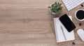 Top view wooden workspace office desk with computer and office supplies. Flat lay work table with blank notebook, keyboard, pen , Royalty Free Stock Photo