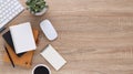 Top view wooden workspace office desk with computer and office supplies. Flat lay work table with blank notebook, keyboard, pen , Royalty Free Stock Photo